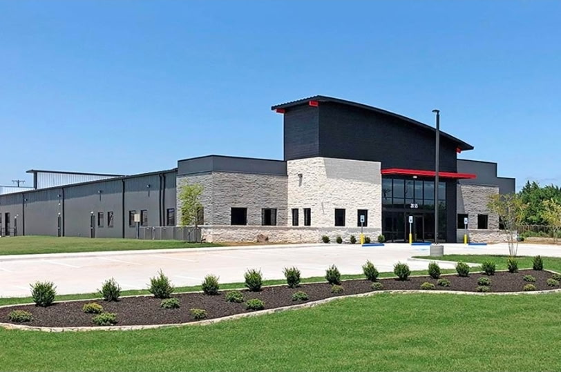 Commercial office and warehouse build with stone facade and standing seam metal roof
